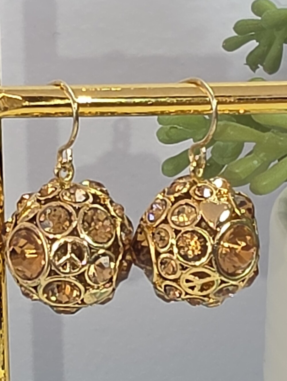 #2614, Vtg Fossil Y2K Crystal ball dangle earrings amber rhinestones with peace